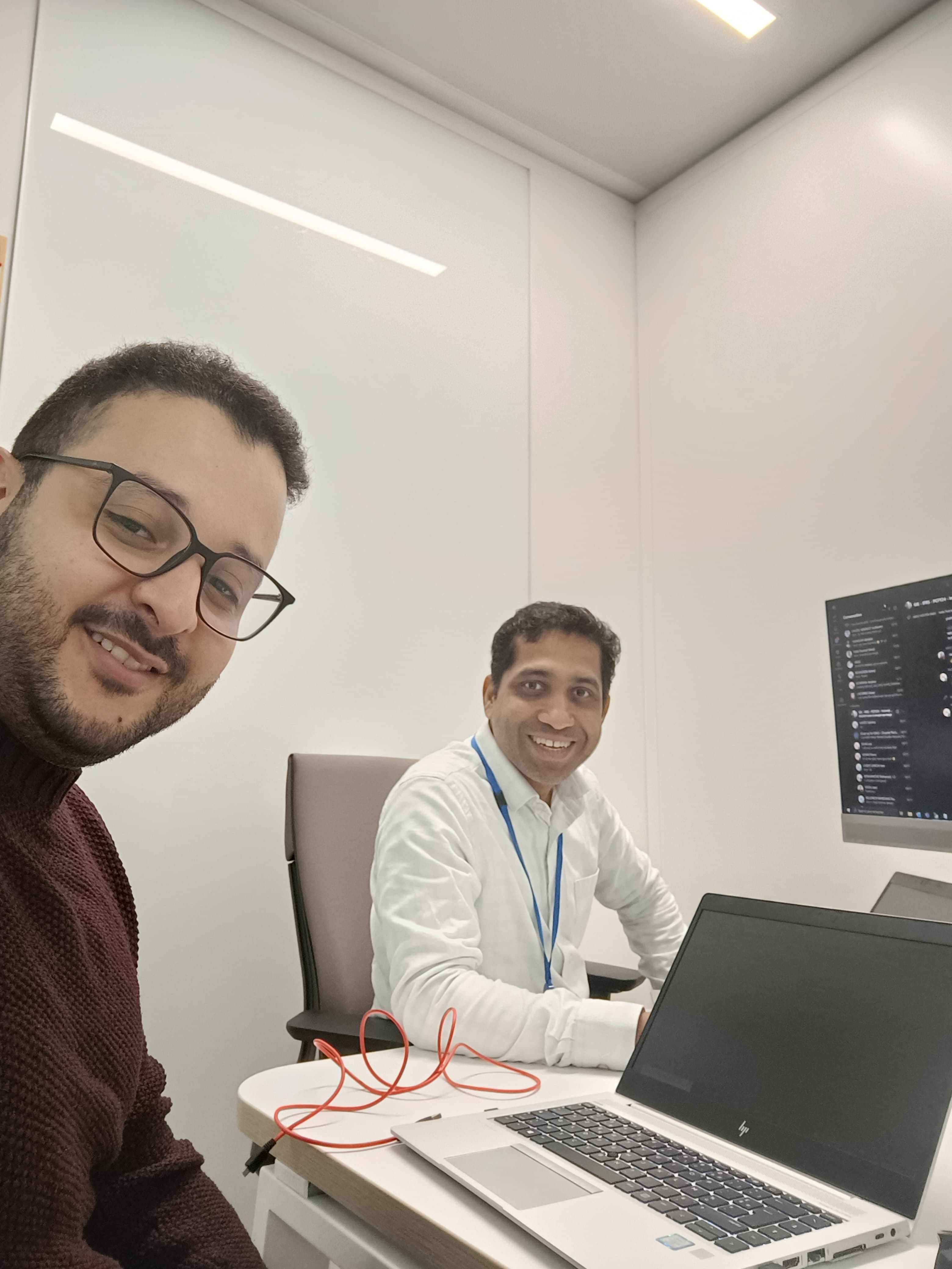 Pramod Naik at work with a colleague